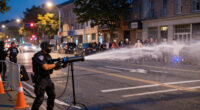 Water cannon fired in latest disorder after Belfast knife attack